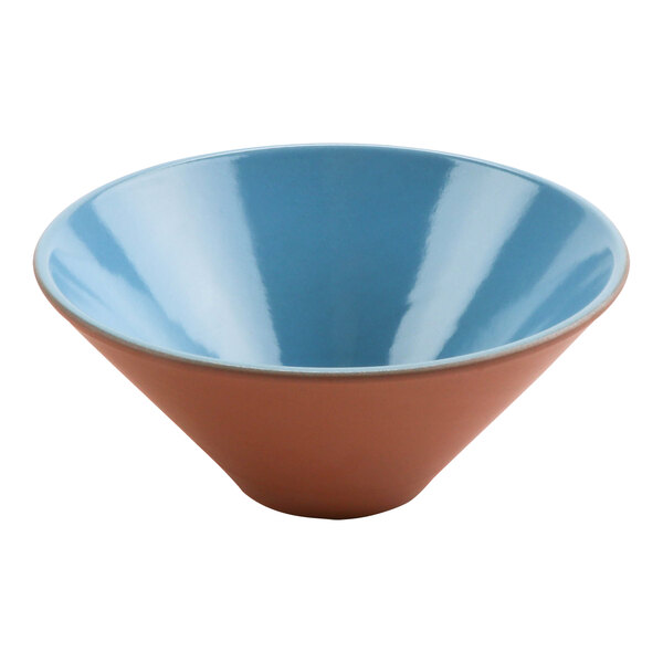 A close-up of a blue bowl with a brown rim.