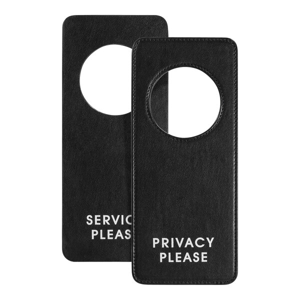 A black faux leather Room360 door hanger with white text reading "Privacy Please" on it.