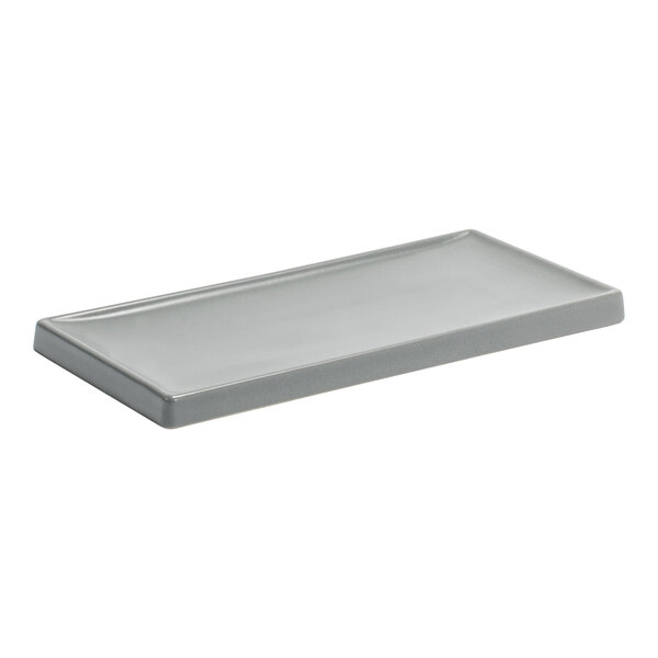 A rectangular gray Room360 amenity tray.