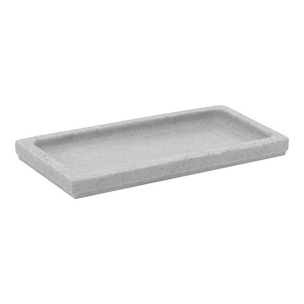 A rectangular gray composite stone Room360 amenity tray.