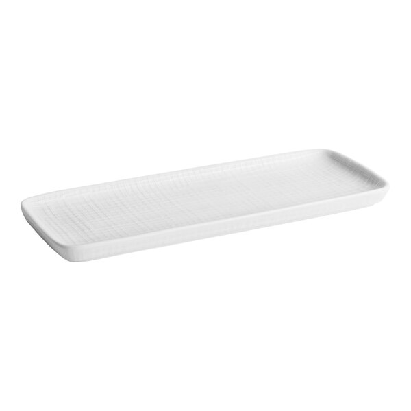 A white rectangular Room360 Toronto amenity tray with a curved edge and a handle.