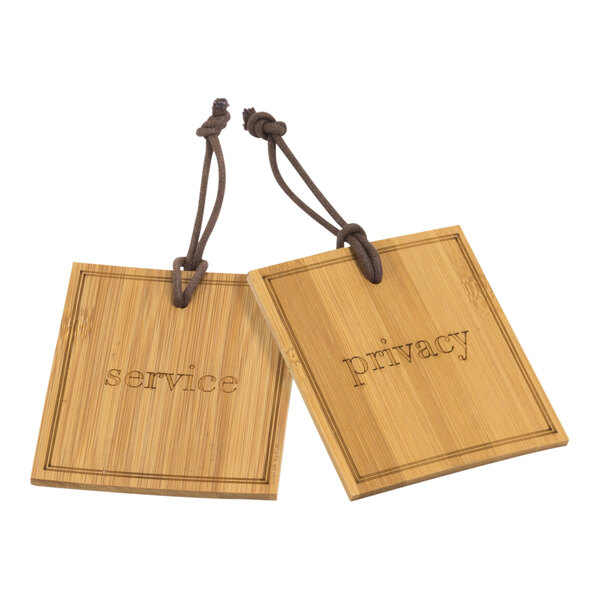 A Room360 Bali bamboo door hanger with wooden tags reading "Privacy" and "Service" hanging on it.