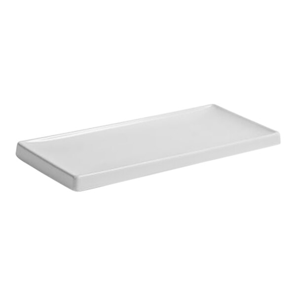 A white rectangular Room360 amenity tray with a handle.