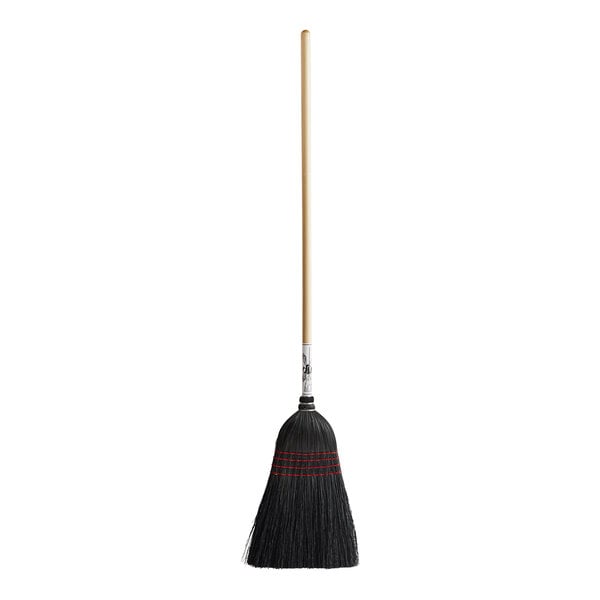 A black Amish-Made broom with a wooden handle.