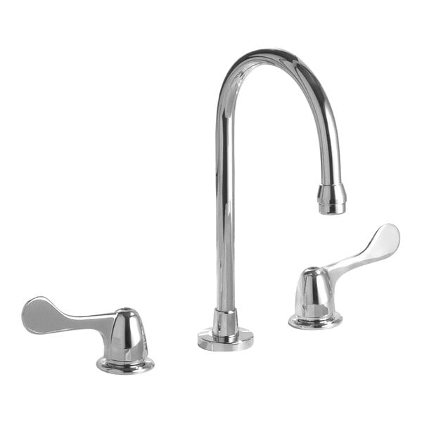 Two Delta chrome deck-mount faucets with blade handles over a sink.