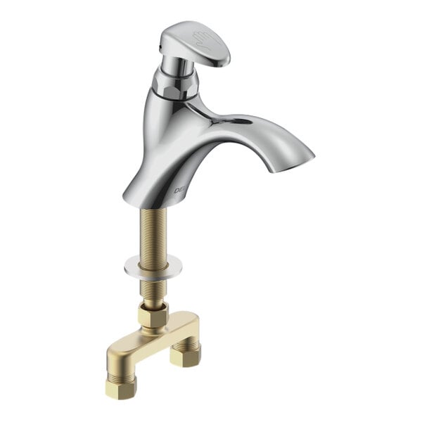 A silver Delta metering faucet with a brass push handle.