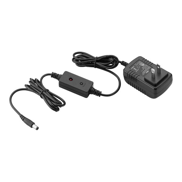 A black Hollowick power adapter with two plugs.