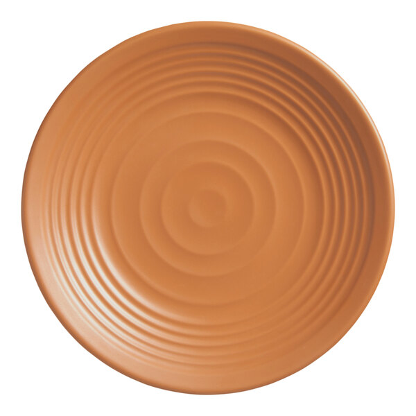 An American Metalcraft terracotta melamine plate with a spiral design on it.