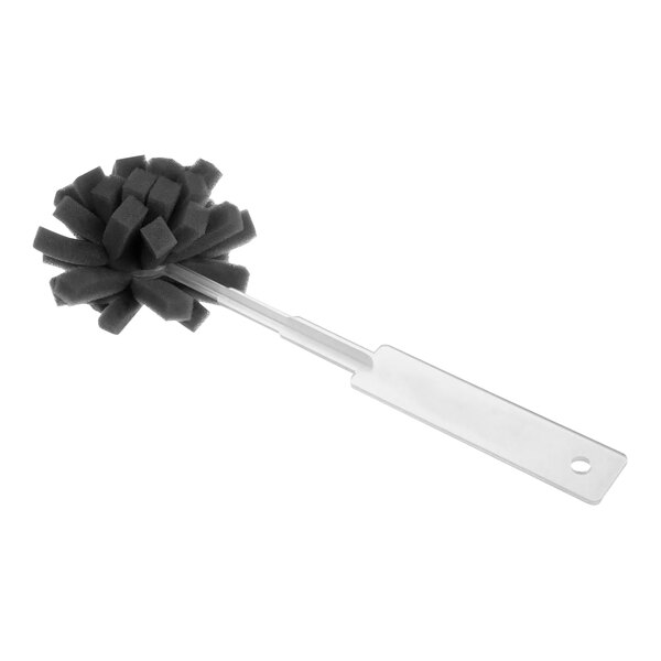 A black brush with a metal handle used to clean coffee machine parts.