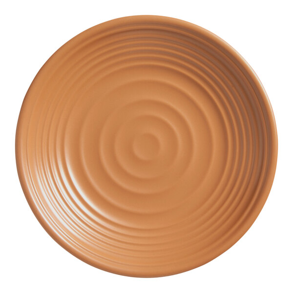 An American Metalcraft terracotta melamine plate with a circular pattern.