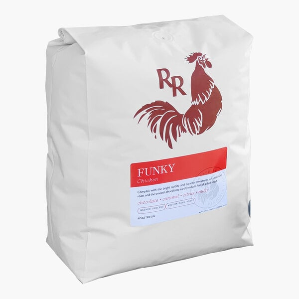 A white bag of Red Rooster Organic Funky Chicken Whole Bean Coffee with a red logo.