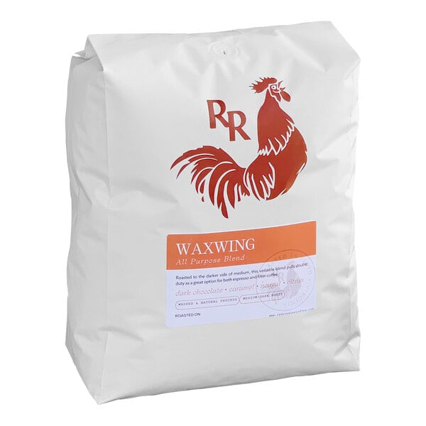 A white bag with a red and white logo for Red Rooster Waxwing All-Purpose Blend Whole Bean Coffee.