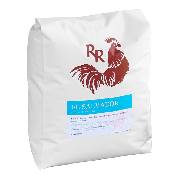 A white bag of Red Rooster El Salvador Finca Hungria whole bean coffee with a red rooster on it.