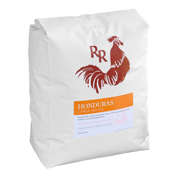 A white bag of Red Rooster Honduras whole bean coffee with a red rooster on the label.