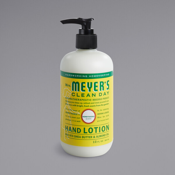 A white Mrs. Meyer's Clean Day honeysuckle hand lotion bottle with a black pump.