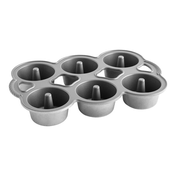 A silver Nordic Ware mini angel food cake pan with six holes.
