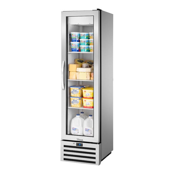 A True one section glass door reach-in refrigerator full of dairy products.