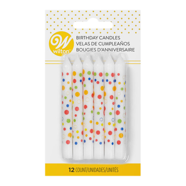 A pack of Wilton birthday candles with assorted color polka dots.
