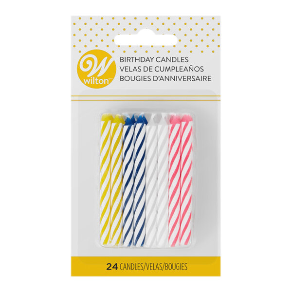 A pack of Wilton assorted color striped birthday candles with yellow and white stripes.