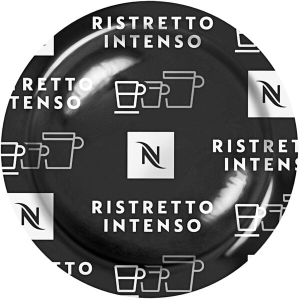 A coffee cup with "Ristretto Intenso" on it on a black plate.