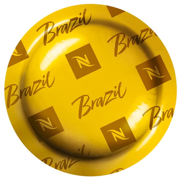 A yellow Nespresso box with black text reading "Brazilian Naturals" on a table.