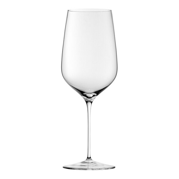 A close-up of a Nude Stem Zero Vertigo clear wine glass with a stem.