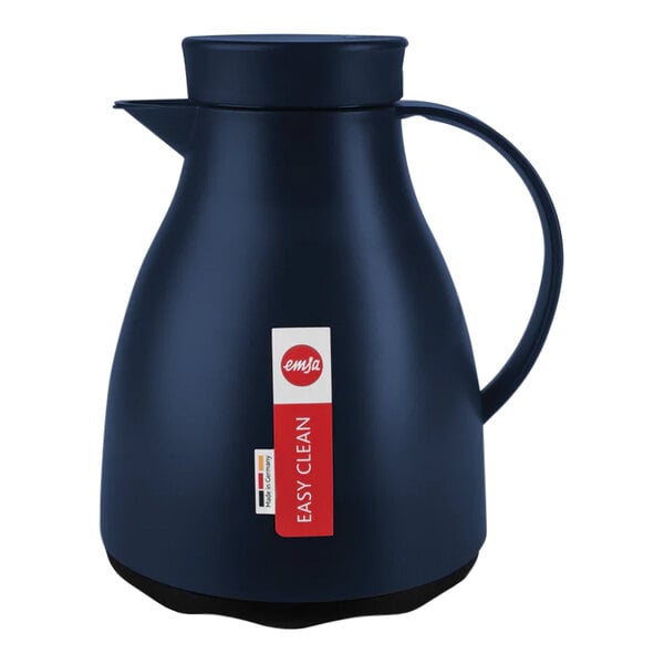 A blue plastic coffee carafe with a handle and a red lid.