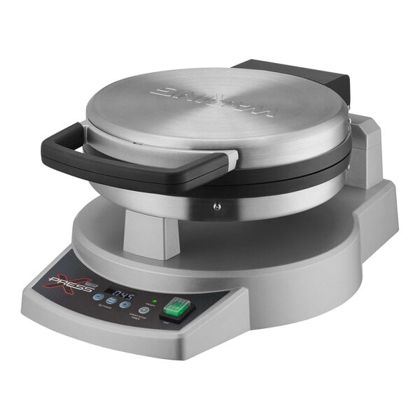 A Waring dual-surface electric cooktop on a counter.