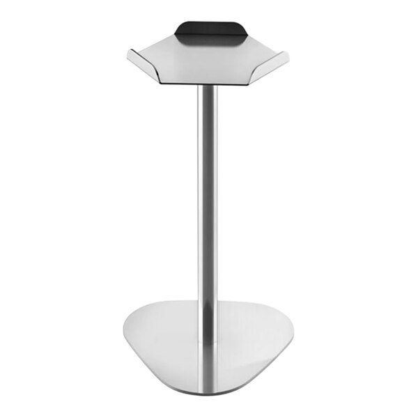 A WMF stainless steel beverage cooler stand on a black and silver table.