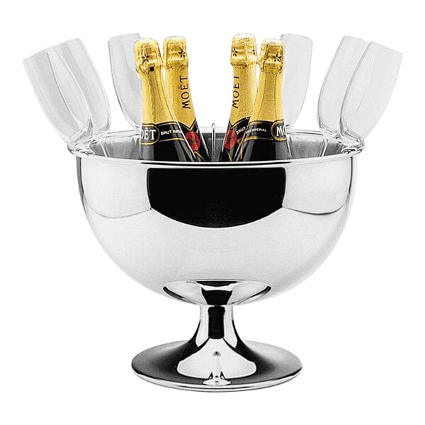 A Hepp stainless steel wine and champagne bowl on a table with champagne bottles inside.