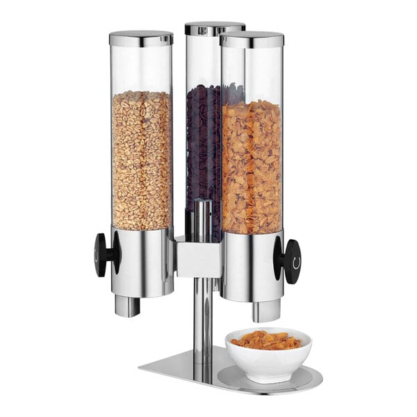 A WMF stainless steel cereal dispenser filled with cereal.
