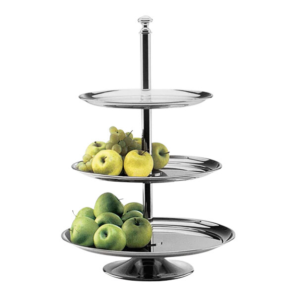 A three tiered Hepp by Bauscher display stand with green and yellow apples.