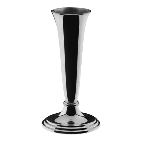 A WMF silver vase on a table.