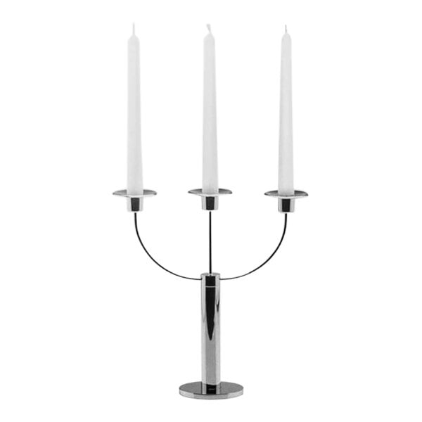 A silver BauscherHepp stainless steel candelabra with three lit white candles.