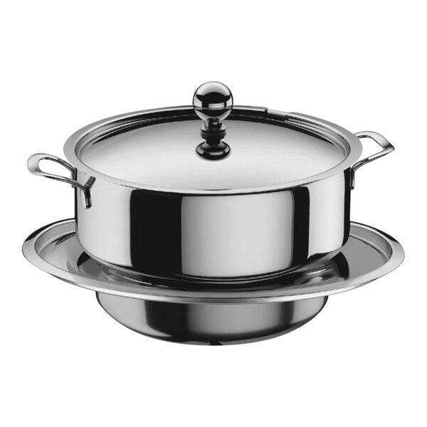 A stainless steel WMF ring for soup tureens on a plate.
