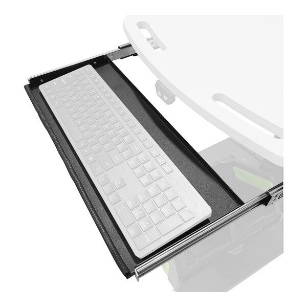 A Newcastle Systems retractable keyboard tray with a keyboard on a black desk.
