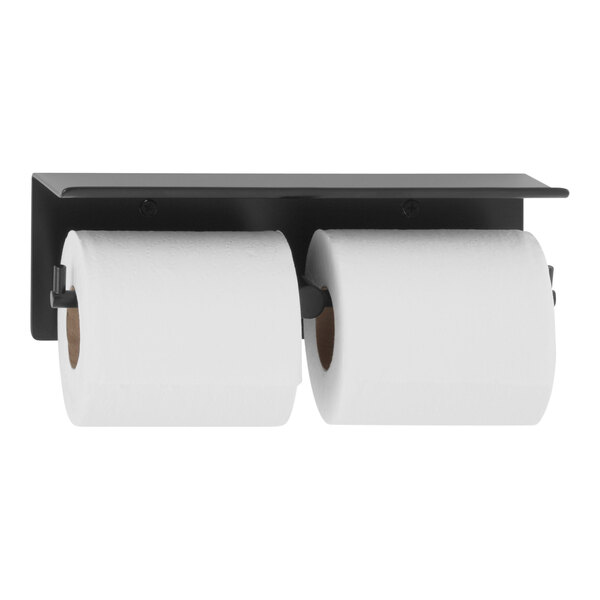 A Bobrick matte black metal shelf with two rolls of toilet paper on it.