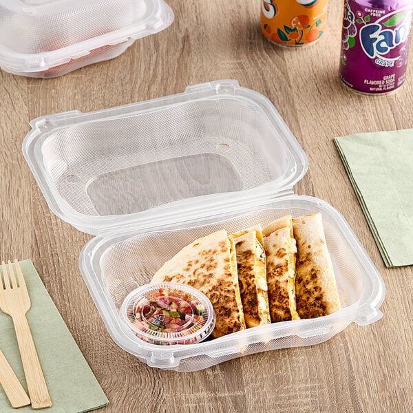 A Genpak clear plastic hinged container with a quesadilla inside.