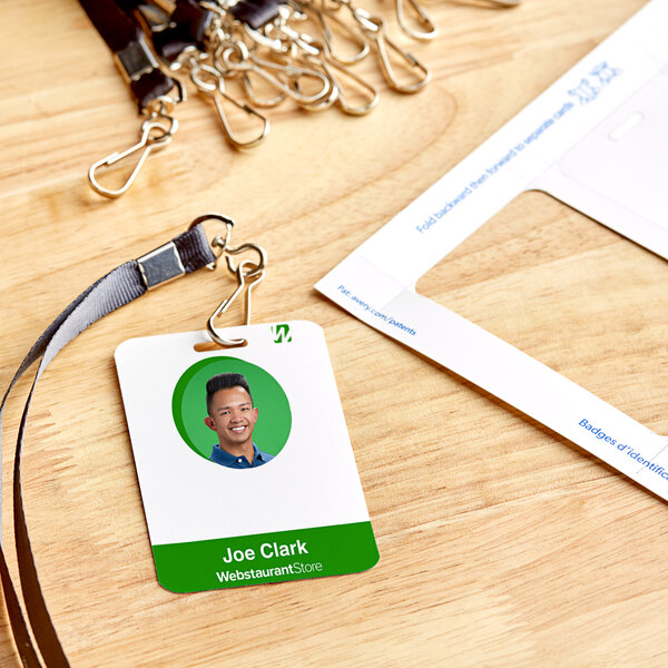 A group of Avery Double-Sided White ID Badges with Clip Holes.