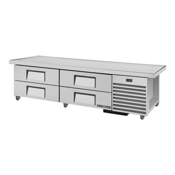 A stainless steel True refrigerated chef base with 4 drawers.