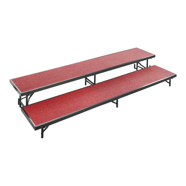 A National Public Seating red carpeted choral riser with two levels.
