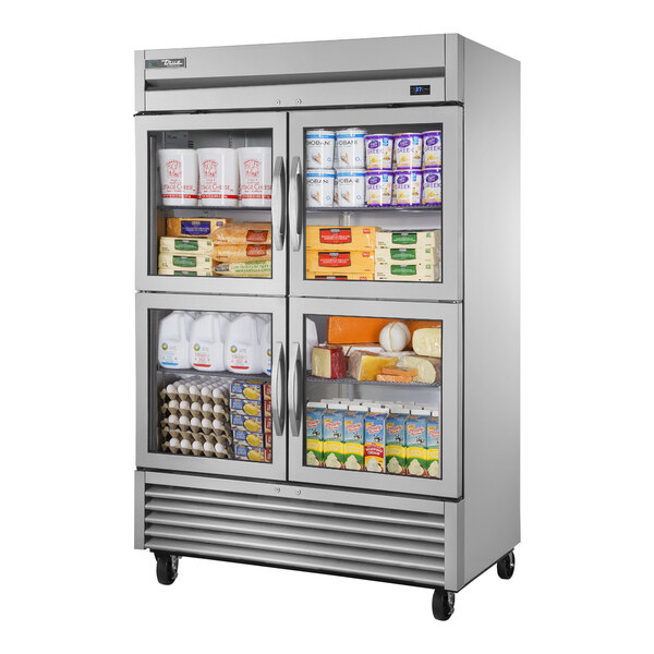 A True stainless steel half glass door reach-in refrigerator filled with True refrigeration products.