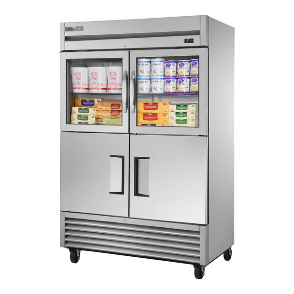 A True stainless steel reach-in refrigerator with glass top and solid bottom doors.