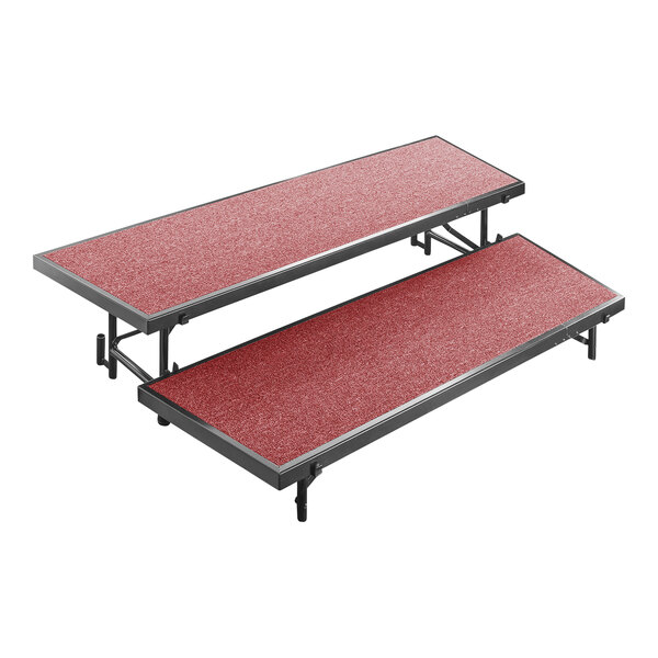 A red carpeted National Public Seating choral riser with two levels.