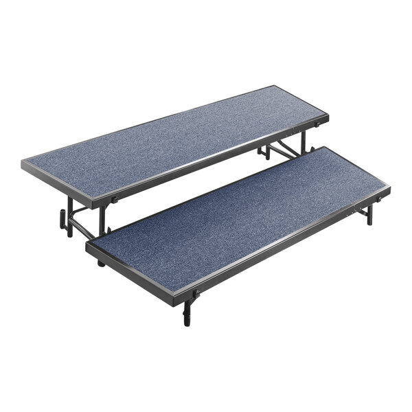 A blue carpeted National Public Seating choral riser with two levels.