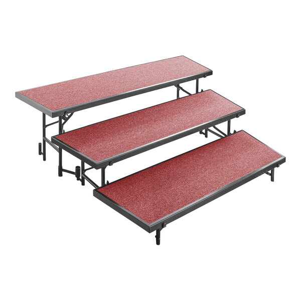 A National Public Seating red carpeted choral riser with three levels.