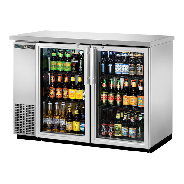 A True stainless steel back bar refrigerator with swing glass doors.
