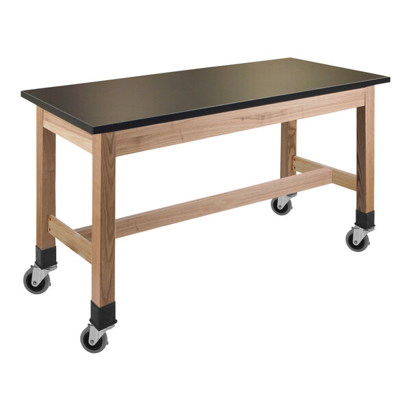 A black National Public Seating science lab table with casters.