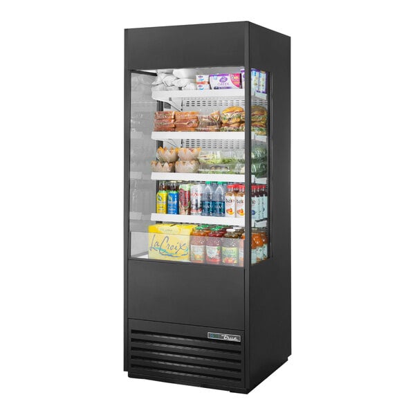 A black True refrigerated air curtain merchandiser with glass sides filled with food and drinks.