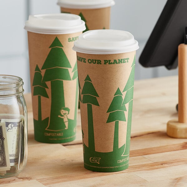 Two EcoChoice paper cups with tree prints and a white lid on a counter.